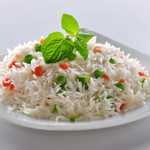 Aromatic basmati rice cooked with peas, carrots, and spices, garnished with mint at Bollywood Masalaz Kuta